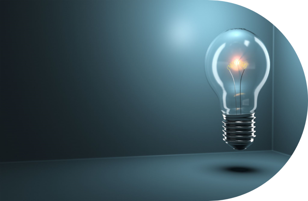 A glowing light bulb floats in a dark, empty room with a soft blue tint, casting a faint shadow on the floor—a quiet nod to innovation in the NZ energy market.