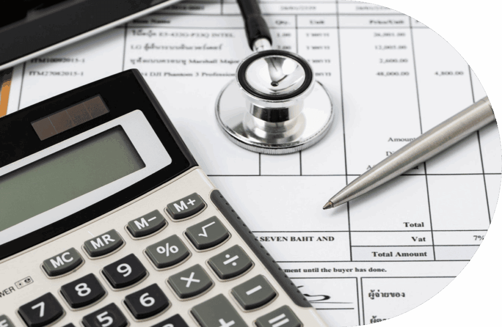 A calculator, stethoscope, and pen rest on medical billing documents, highlighting the connection between healthcare and financial calculations in New Zealand's fit for purpose capitation formula system.
